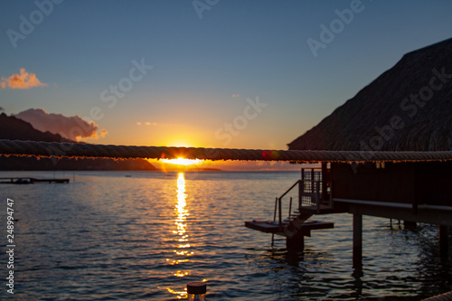 Beautiful sunset from walk way of over the water bungalows © eacmich