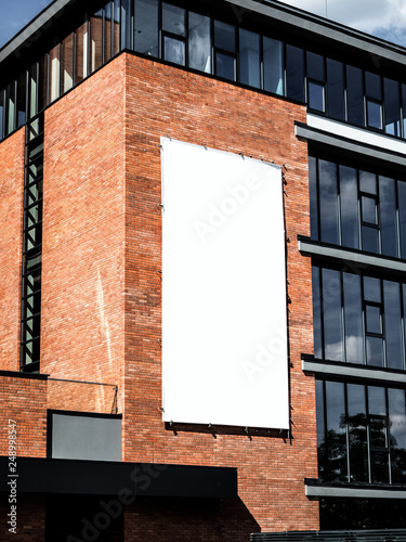 University, company office building facade, Blank white paper board at grunge brick red wall texture background, Mock up ads template, Business presentation content concept. 