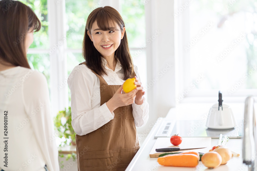 attractive asian women cooking in kitchen attractive asian women cooking in kitchen