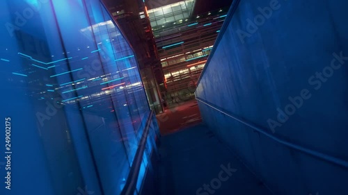 Push in and Dutch Angle, Blue lights on building, Night, Movement (gimbal) photo