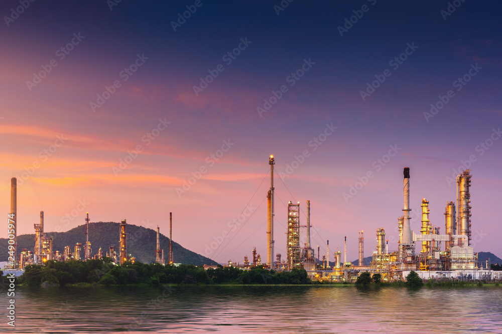 Landscape of oil and gas refinery manufacturing plant., Petrochemical or chemical distillation process buildings., Factory of power and energy industrial at twilight sunset., Engineering petroleum.