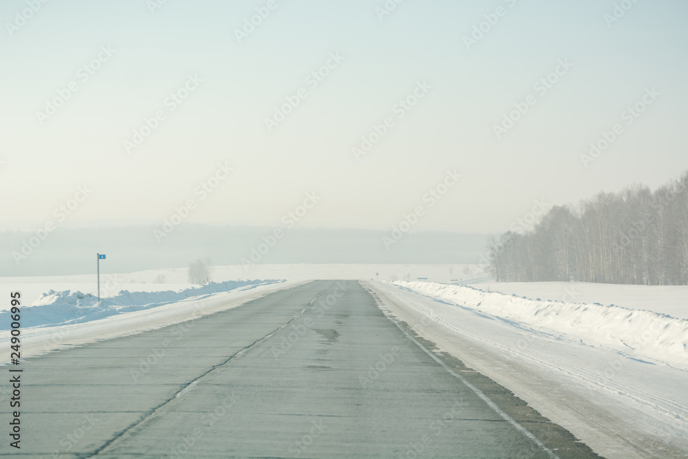 Asphalt road in winter. Winter landscapes. Russia in the winter.