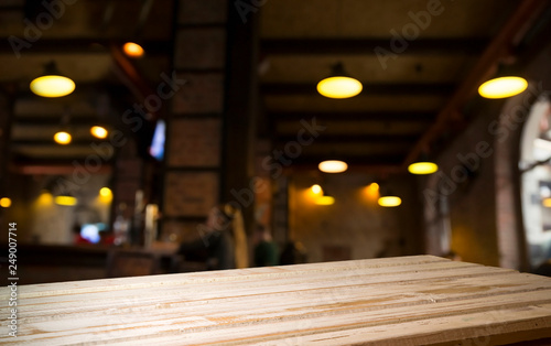 Beer barrel with beer glasses on a wooden table. The dark brown background.