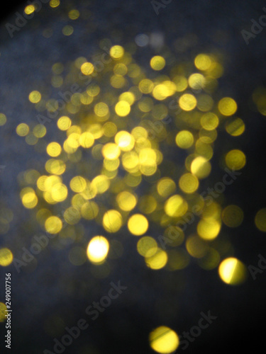 abstract blurred glowing lights of yellow and gold shades