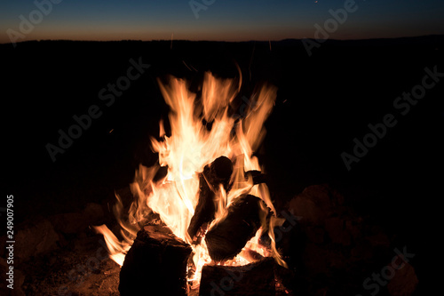 Wood buring fire isolated on black