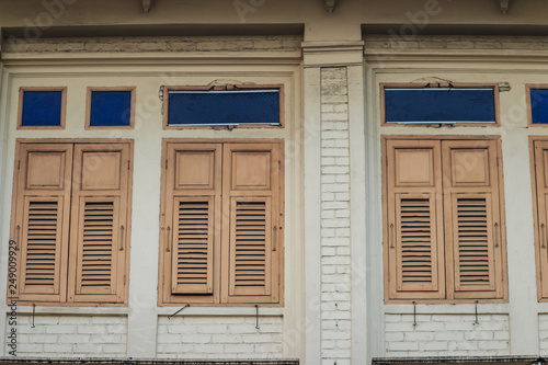 Old vintage wooden brown house windows background.