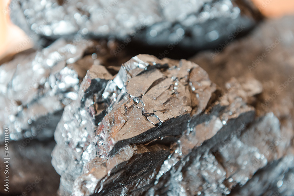 Coal close up. The structure of coal. Fuel for heating. Use the stove. Natural fossil. Coal close up. The structure of coal. Fuel for heating. Use the stove. Natural fossil.