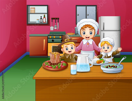 Happy children and mom cooking food in the kitchen