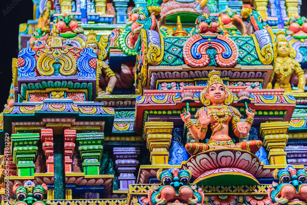 Colorful night view of indian gods sculpture at Sri Maha Mariamman Temple, also known as Maha Uma Devi temple, the public hindu temple in Silom, Bangkok, Thailand. It known as Wat Khaek Silom.