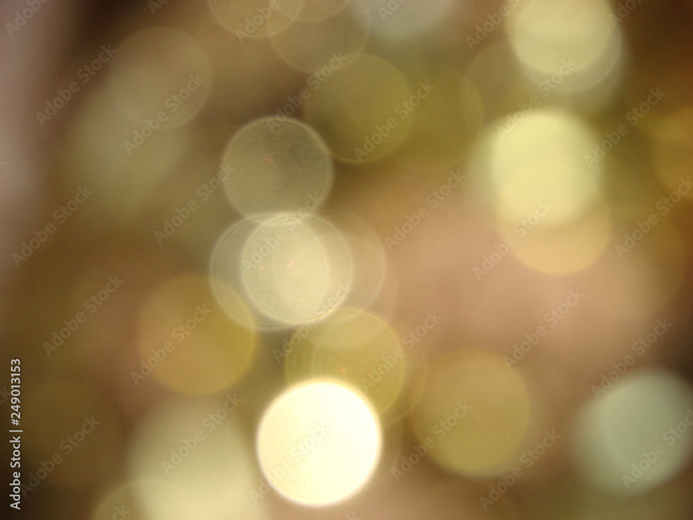 abstract blurred glowing lights of light gold shades