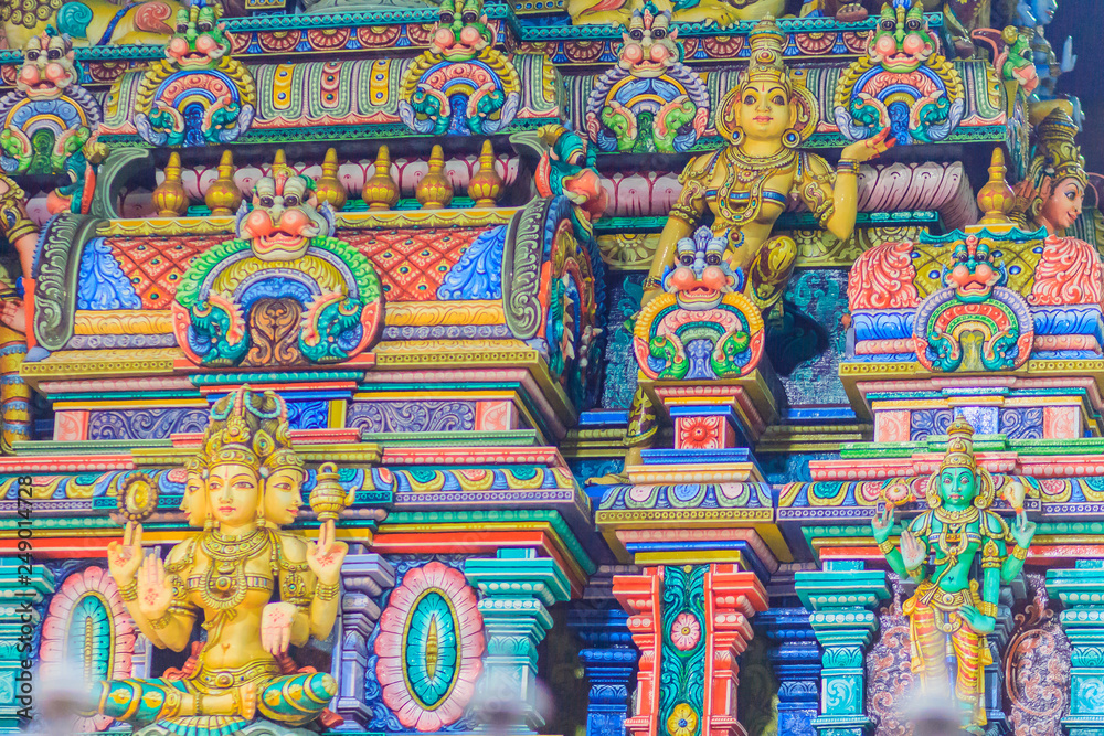 Colorful night view of indian gods sculpture at Sri Maha Mariamman Temple, also known as Maha Uma Devi temple, the public hindu temple in Silom, Bangkok, Thailand. It known as Wat Khaek Silom.