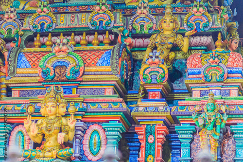 Colorful night view of indian gods sculpture at Sri Maha Mariamman Temple, also known as Maha Uma Devi temple, the public hindu temple in Silom, Bangkok, Thailand. It known as Wat Khaek Silom.