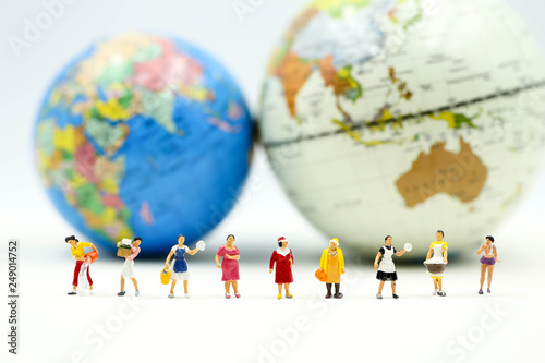 Miniature people : Group of Women Teamwork Happiness with world map using for concept of International women day.