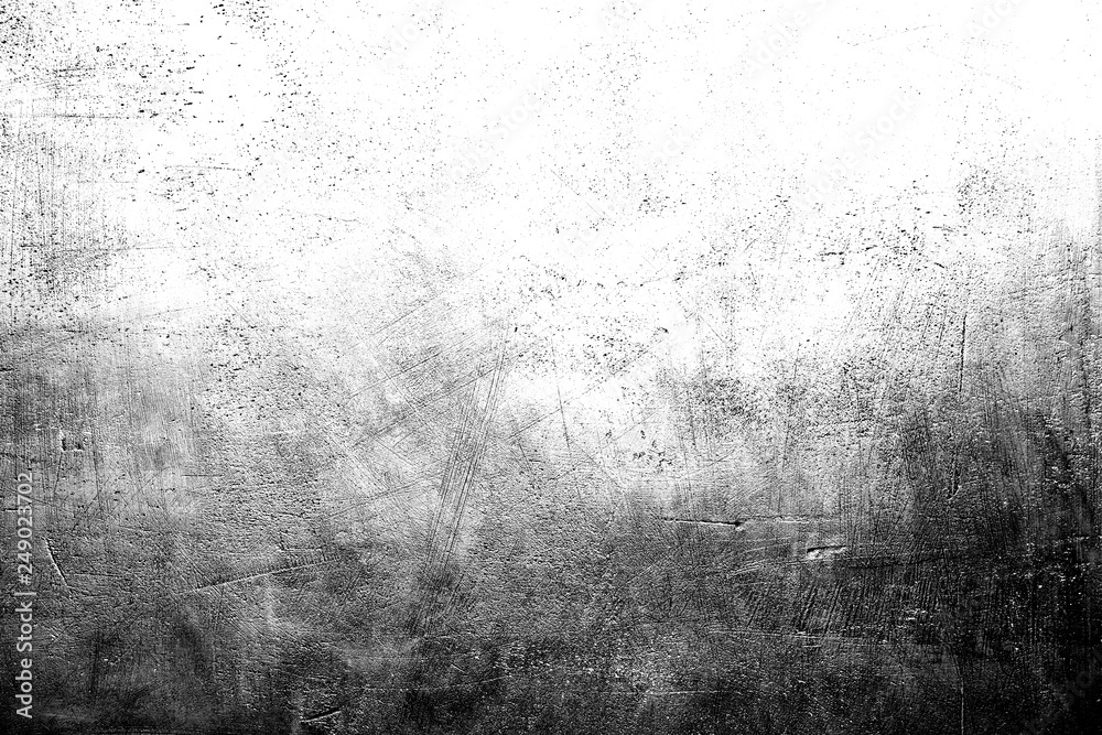 Fototapeta premium Black and white scratched grunge plaster wall texture for background with copy space on top.