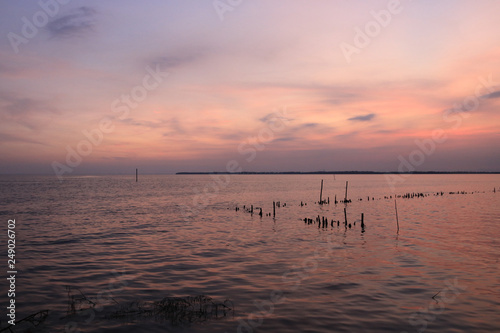 The sea and the sunset  colorful at Don Hoi lot. Samut songkhram province. Country Thailand - Image   