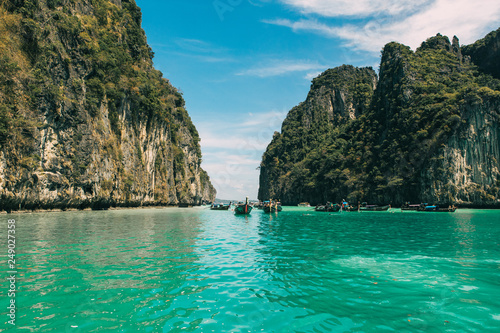 view of iconic tropical turquoise water Pileh Lagoon surrounded by limestone cliffs, Phi Phi islands, Thailand 