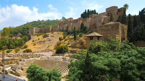 Panorama view of the roman theatre and The Alcazaba, arab castle in Malaga, Spain on a sunny day. photo