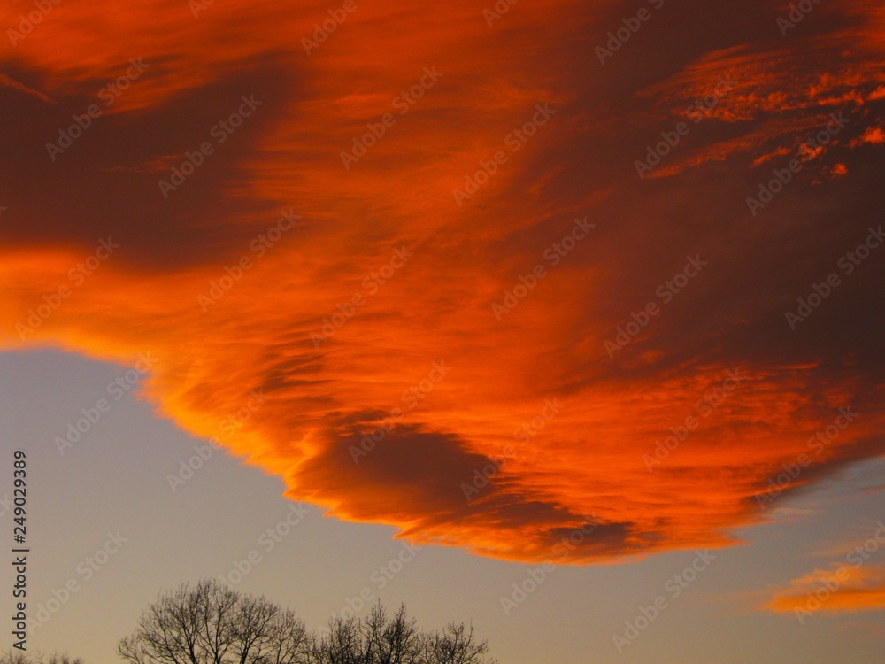Evening sky with a cloud in the red tones of sunset