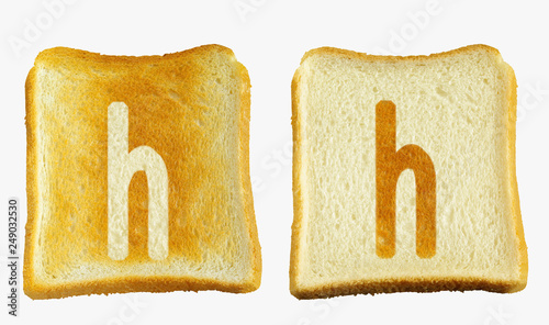 トーストに白い小文字のhと白いパンに小文字のhの焼き目が入った2枚のパン photo