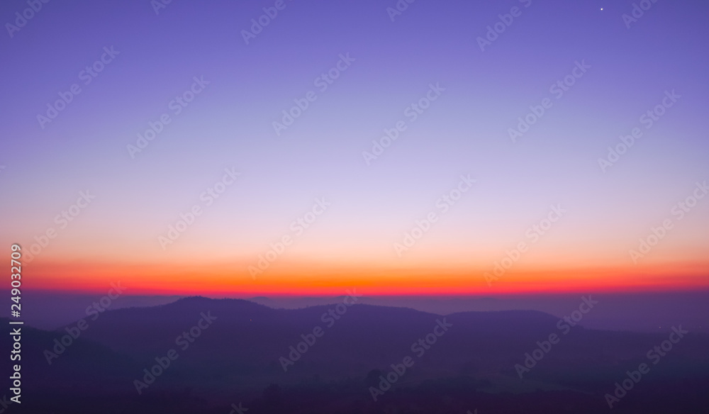 Dawn sky above the mountains and the horizon.
