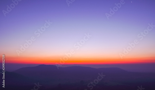 Dawn sky above the mountains and the horizon.