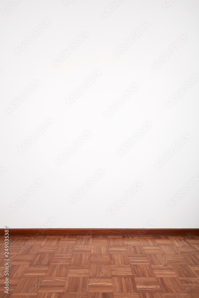 Fototapeta premium Room with brown wooden tiled floor and white blank wall