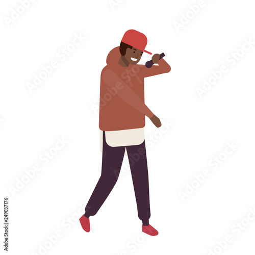 African American R'n'B vocalist wearing cap performing on stage