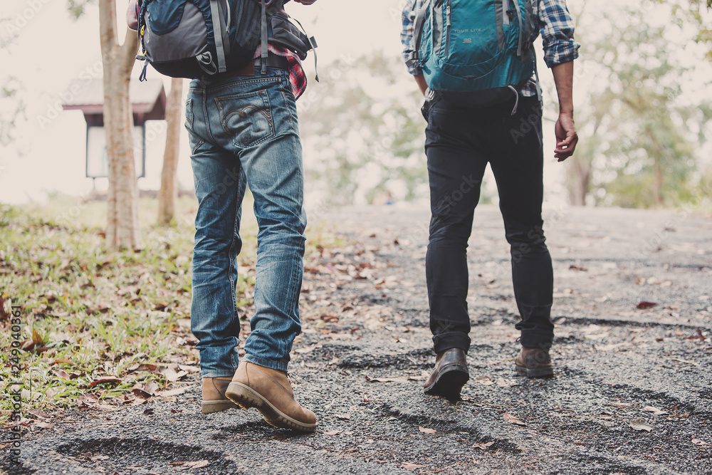 Hiking man traveling with backpack in mountains Hiking man traveling with backpack in mountains