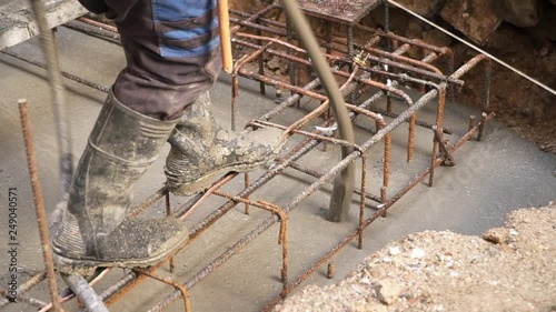 Builder using a concrete vibrator