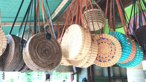 Rattan eco bags in the art shop on Bali island, Indonesia. Woman stylish eco bag. photo