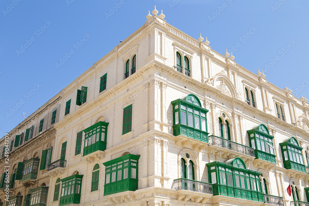 Stone houses with Maltese balconies in the city of Valletta, Malta