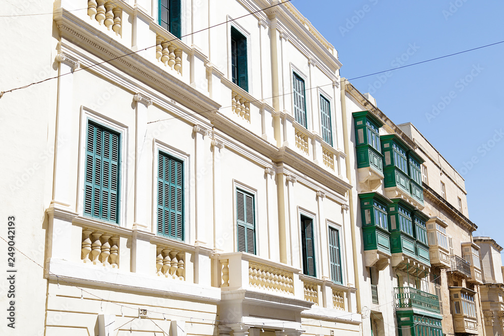 Stone houses with Maltese balconies in the city of Valletta, Malta