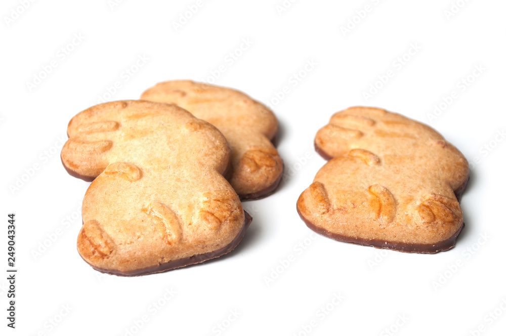closeup of easter chocolate biscuits in shaped rabbits on white background closeup of easter chocolate biscuits in shaped rabbits on white background