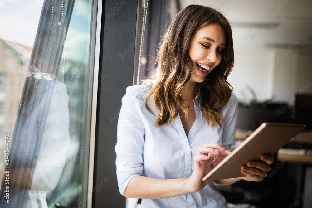 © NDABCREATIVITY - Successful business woman looking confident and smiling © NDABCREATIVITY - Successful business woman looking confident and smiling