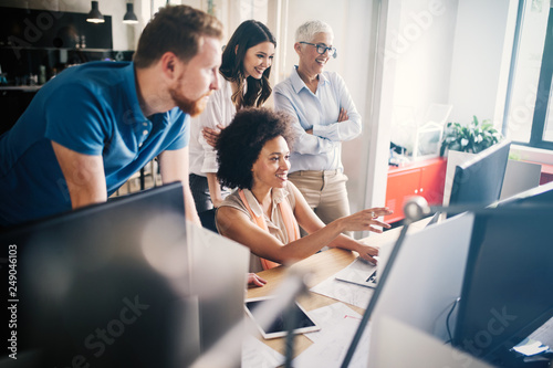 Group of successful business people at work in office