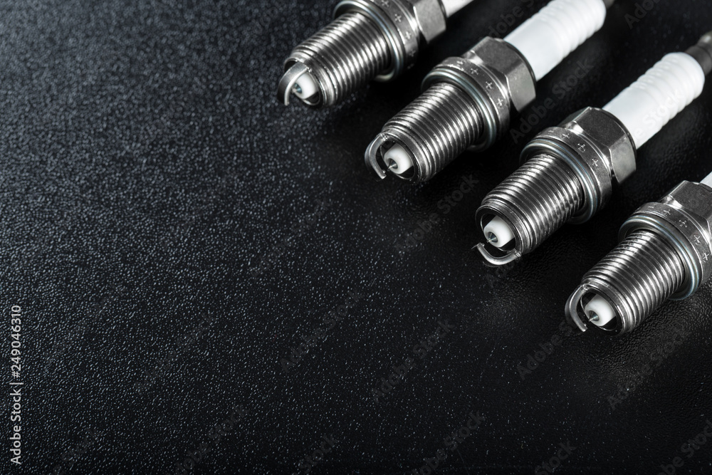 Spark plugs on black background Spark plugs on black background