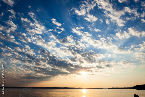 Clouds and sunrays at sunrise