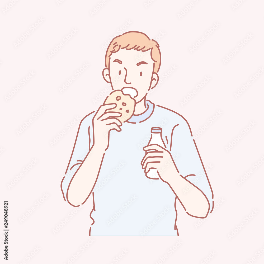 Man eating cookie and drink milk Man eating cookie and drink milk