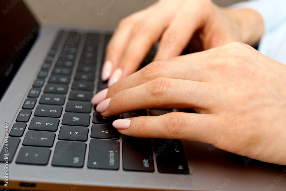 female hands on the laptop keyboard female hands on the laptop keyboard