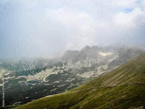 Fototapeta Naklejka Na Ścianę i Meble -  Tatra Mountain part of Carpathian mountain chain in eastern Europe create natural border between Slovakia, Poland. Both protected as national parkland popular destination for winter, summer sports.