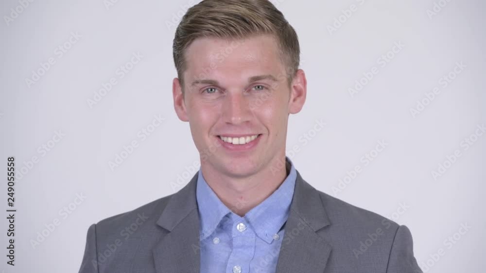 Face of young happy businessman in suit smiling Face of young happy businessman in suit smiling