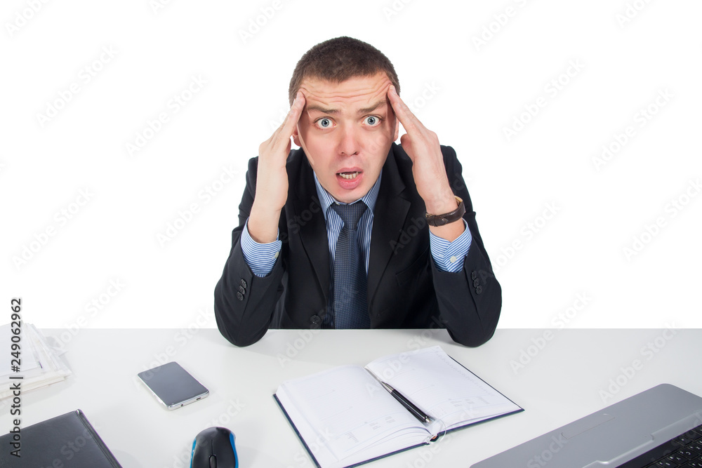 Shocked businessman with laptop computer and documents at office Shocked businessman with laptop computer and documents at office