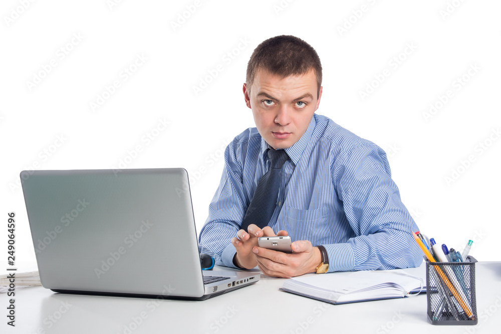 Businessman with phone at workplace isolated on white background