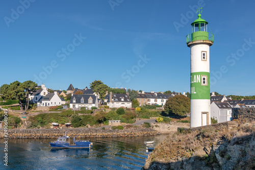 French landscape - Bretagne. Lighthouse in a small fishing village.