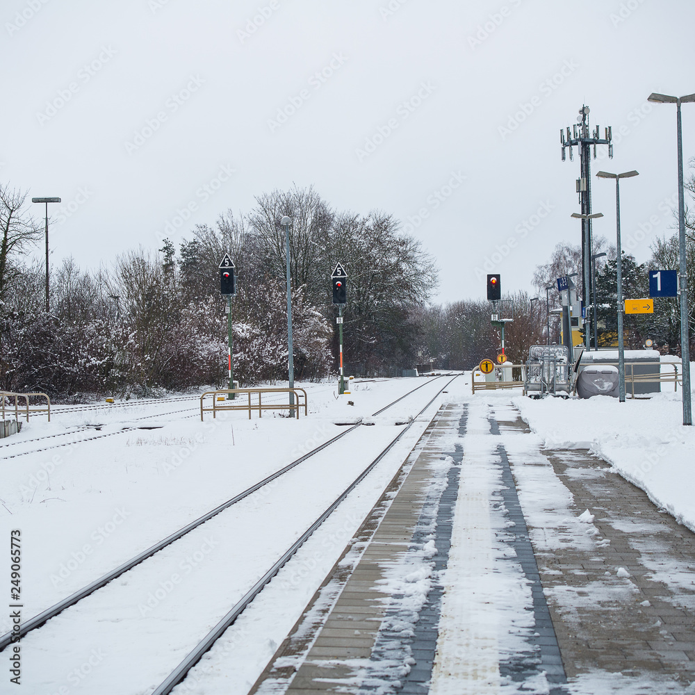 View of platform covered with snow at train station