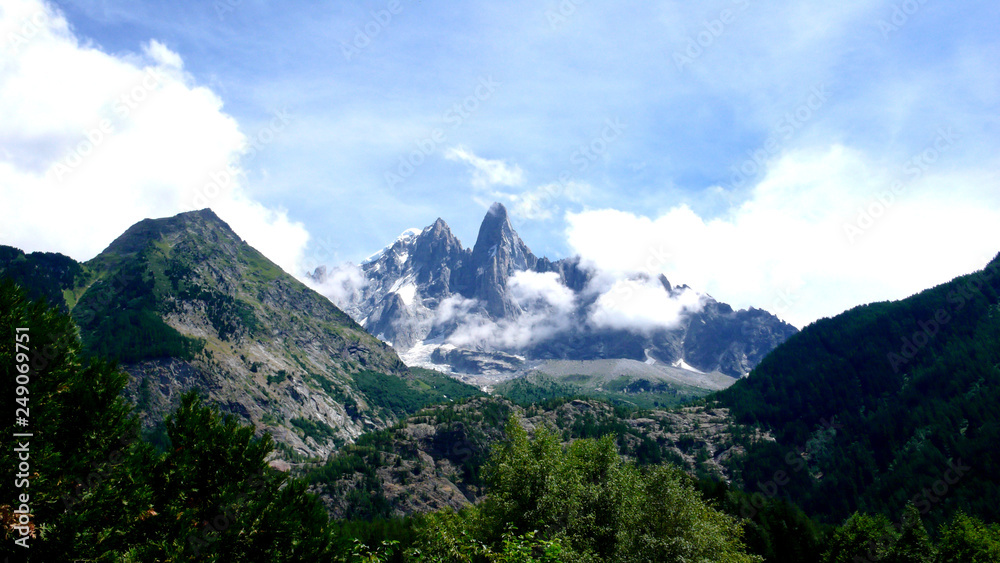 jagged mountain peak landscape with clouds