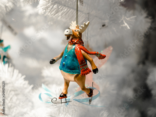 Christmas decoration, A deer skiing, merry Christmas new year winter with snow falling and white Christmas trees, modern concept for Christmas.