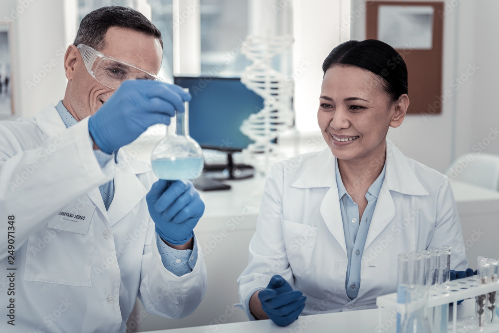 Scientists studying the content of the bulb Scientists studying the content of the bulb