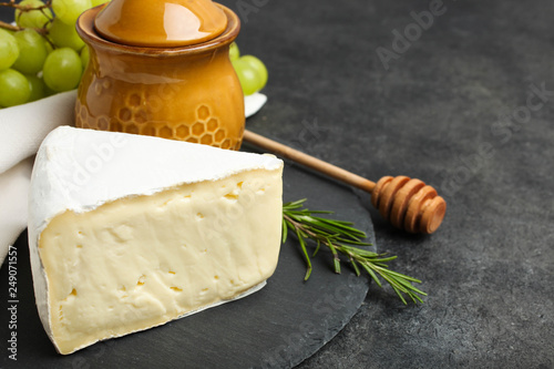 white Camembert cheese with honey and white grapes