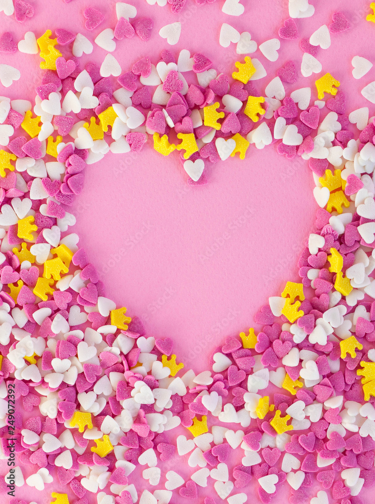 Confectionery decorations around a pink heart